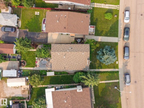 Aerial view highlighting a residential property with a shingle roof and a paved driveway - 18126 98 Avenue, Edmonton, AB 