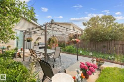 Paved patio area featuring a metal gazebo structure - 