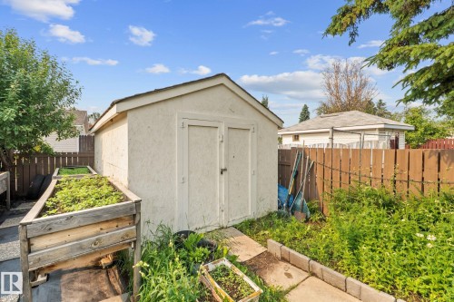 Outbuilding with a peaked roof and double doors - 18126 98 Avenue, Edmonton, AB 
