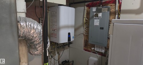 Wall-mounted water heater with associated plumbing - 16505 133 Street, Edmonton, AB 