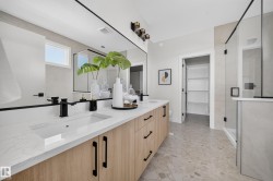 Dual vanity with integrated sinks and wood-finish cabinetry - 