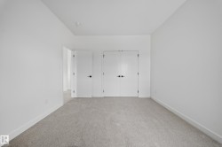 Carpeted room with a recessed ceiling light - 