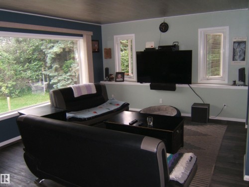Expansive windows frame exterior greenery - 163062 Twp Rd 565, Rural Lamont County, AB 
