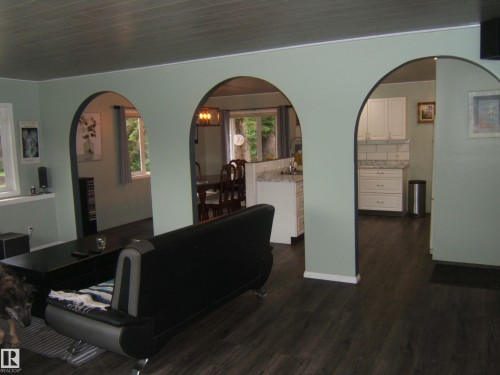 Interior featuring three arched openings - 163062 Twp Rd 565, Rural Lamont County, AB 