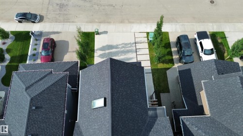 New construction properties featuring dark shingle roofs - 104 Edgewater Circle, Leduc, AB 