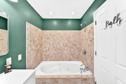 Soaking tub with integrated jets and chrome fixtures - 