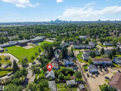 Aerial perspective showcasing a residential neighborhood with a distant cityscape - 
