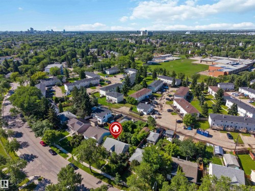 Residential neighborhood featuring mature trees, paved streets, and varied housing styles - 12943 Sherbrooke Avenue, Edmonton, AB 