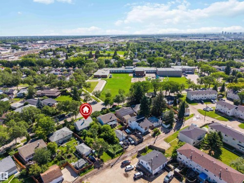 Aerial perspective of a residential area featuring numerous mature trees and green spaces - 12943 Sherbrooke Avenue, Edmonton, AB 