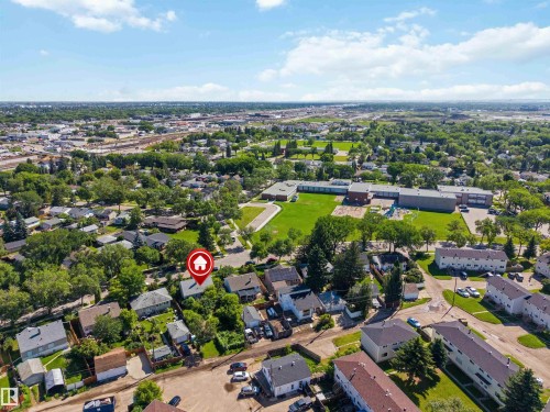Aerial perspective of a residential neighborhood featuring established homes with mature trees and green spaces - 12943 Sherbrooke Avenue, Edmonton, AB 