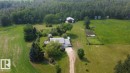 Expansive property featuring a two-story residence, detached garage, and multiple outbuildings - 59228 Rg Rd 11, Rural Westlock County, AB 