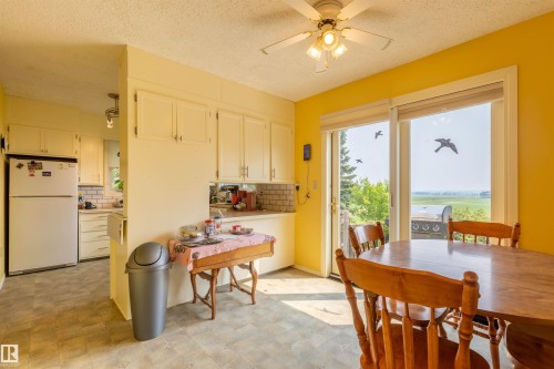 Dining area with sliding glass door access to an outdoor space - 59228 Rg Rd 11, Rural Westlock County, AB 