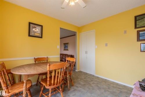 Dining area featuring light yellow walls and a drop-leaf table - 59228 Rg Rd 11, Rural Westlock County, AB 