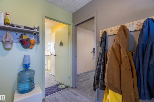 Interior entryway featuring wood-finish flooring and light-toned walls - 59228 Rg Rd 11, Rural Westlock County, AB 