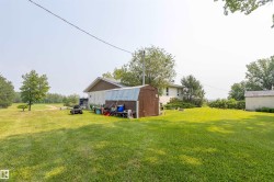 Expansive green lawn surrounds the property - 
