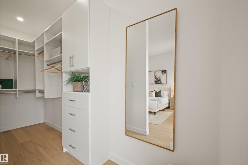 Custom built-in closet system featuring white cabinetry with brushed nickel hardware - 14037 104 Avenue, Edmonton, AB - Indoor Photo Showing Other Room
