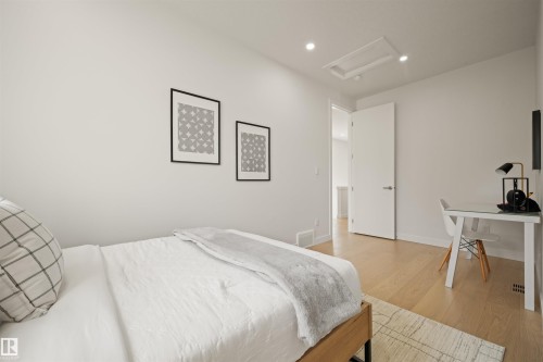 Bright room featuring light wood-finish flooring and recessed ceiling lighting - 14037 104 Avenue, Edmonton, AB - Indoor Photo Showing Bedroom