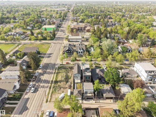 Aerial perspective showcasing a residential area with mature trees - 14037 104 Avenue, Edmonton, AB - Outdoor With View