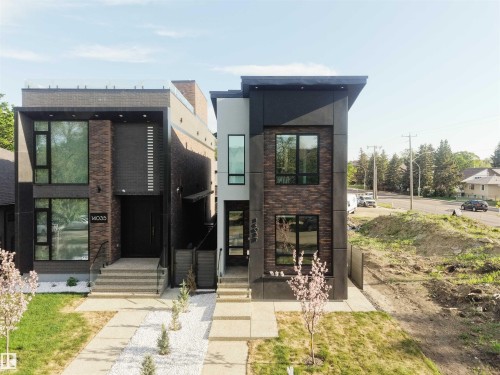 Modern architectural design featuring dark brick and paneling with large windows - 14037 104 Avenue, Edmonton, AB - Outdoor
