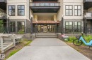 Building facade featuring a prominent entrance with "GATES ON 117th" signage, dark brick accents, and multiple windows - 126 10531 117 Street, Edmonton, AB 