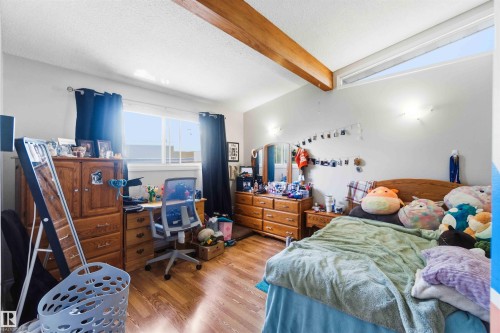 Wood-finish flooring with a horizontal window and a high clerestory window - 13121 122 Street, Edmonton, AB 