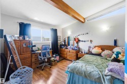 Wood-finish flooring with a horizontal window and a high clerestory window - 