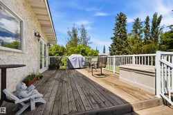 Expansive wood deck with white railings - 