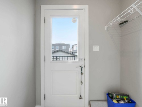 White paneled door with upper glass panel - 516 35 Street, Edmonton, AB 