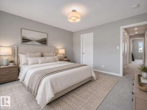 Bedroom featuring plush carpeting, a neutral color palette, and a modern ceiling light fixture - 516 35 Street, Edmonton, AB 