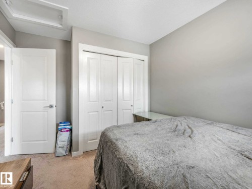 Neutral-toned room featuring light gray walls and plush carpet flooring - 516 35 Street, Edmonton, AB 