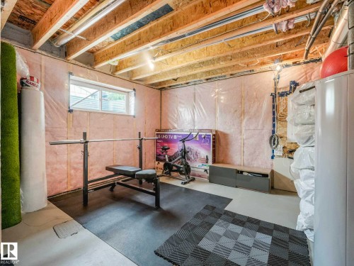 Unfinished basement with exposed ceiling joists and wall insulation - 516 35 Street, Edmonton, AB 