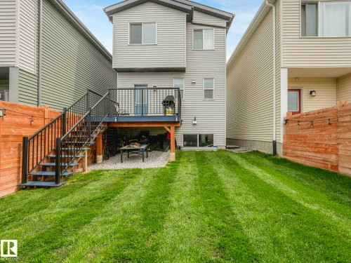 Rear exterior of a two-story residence featuring light-colored siding - 516 35 Street, Edmonton, AB 