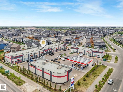 Commercial strip center with multiple storefronts and surface parking - 516 35 Street, Edmonton, AB 