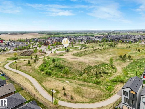Expansive neighborhood featuring residential homes, green spaces, and paved walking paths - 516 35 Street, Edmonton, AB 