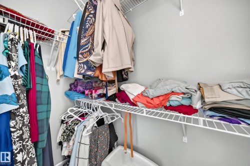 Customizable closet system featuring wire shelving and hanging rods - 10-415 Clareview Rd Nw Nw, Edmonton, AB 