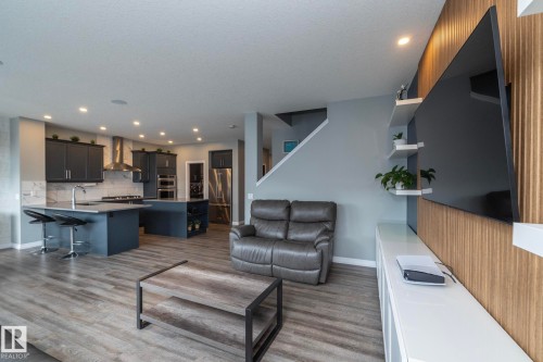 Open-concept living space featuring wood-finish flooring - 923 Mcconachie Boulevard, Edmonton, AB 