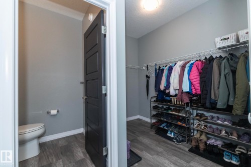 Functional storage area featuring wire shelving and wood-finish flooring - 923 Mcconachie Boulevard, Edmonton, AB 