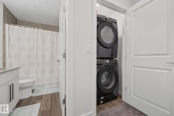 Dedicated laundry closet with stacked appliances - 