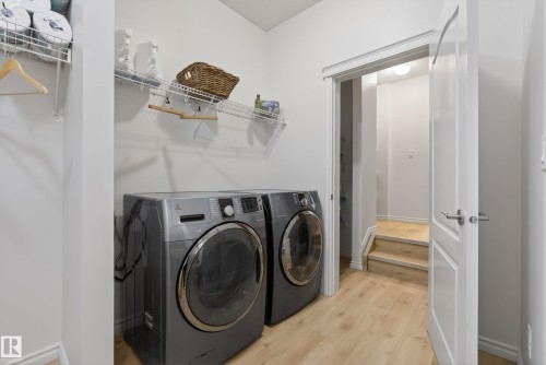 Dedicated laundry area featuring light wood-finish flooring - 2696 Anderson Crescent, Edmonton, AB - Indoor Photo Showing Laundry Room