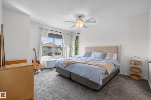 Bedroom featuring light-colored walls and grey carpet - 2696 Anderson Crescent, Edmonton, AB - Indoor Photo Showing Bedroom
