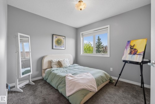 Room with light grey walls, white trim, and dark grey carpet flooring - 2696 Anderson Crescent, Edmonton, AB - Indoor Photo Showing Bedroom