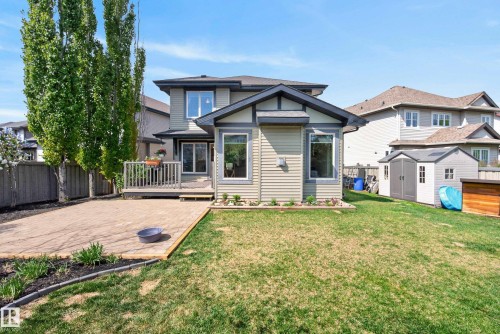 Rear exterior featuring a deck, paver patio, and lawn space - 2696 Anderson Crescent, Edmonton, AB - Outdoor