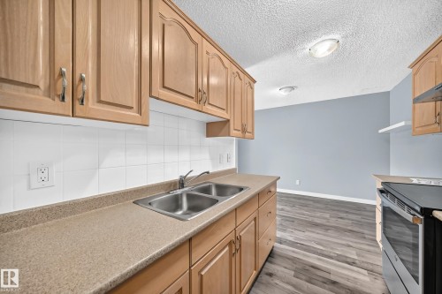 261 Callingwood Two Nw, Edmonton, AB - Indoor Photo Showing Kitchen With Double Sink