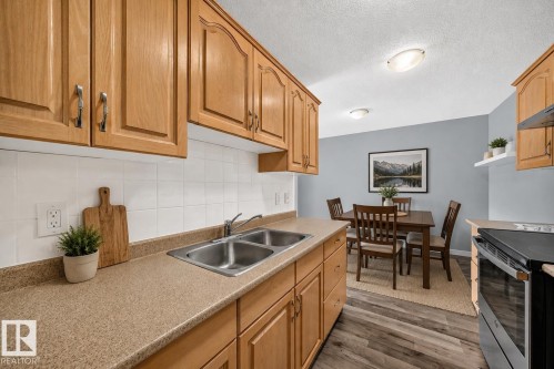 261 Callingwood Two Nw, Edmonton, AB - Indoor Photo Showing Kitchen With Double Sink