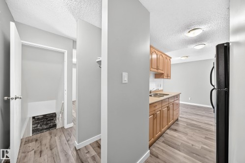 261 Callingwood Two Nw, Edmonton, AB - Indoor Photo Showing Kitchen With Double Sink