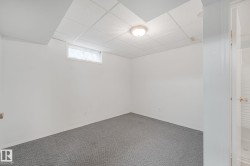 Neutral white walls and grey carpeting create a versatile foundation - 