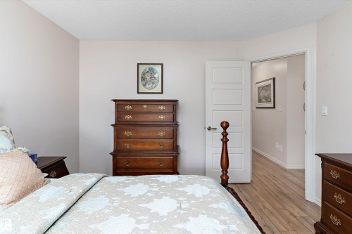 Interior room with light neutral walls and wood-finish flooring - 1097 Armitage Crescent, Edmonton, AB 