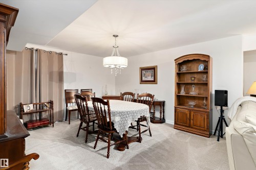 Interior space featuring light-toned carpeting and neutral wall paint - 1097 Armitage Crescent, Edmonton, AB 