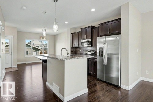 2 Simmonds Place, Leduc, AB - Indoor Photo Showing Kitchen With Upgraded Kitchen