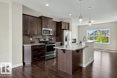 2 Simmonds Place, Leduc, AB - Indoor Photo Showing Kitchen With Upgraded Kitchen